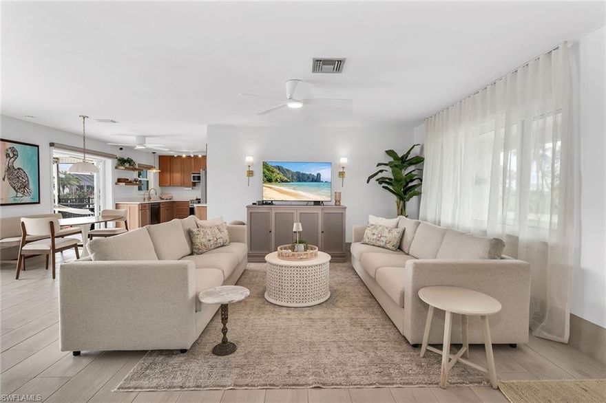 Located in the sought-after Sandpiper Village, this southern-exposure waterfront residence offers a rare combination of canal views, Gulf access, and a private dock with a boat lift, perfectly suited for boating enthusiasts and those seeking the ultimate Fort Myers Beach lifestyle. With an ideal orientation that captures abundant natural light throughout the day, the setting delivers a true sense of relaxed coastal living with endless opportunities for outdoor enjoyment. The thoughtfully designed floor plan includes two bedrooms, two full baths, and a one-car garage. Impact-resistant doors and windows provide peace of mind while enhancing energy efficiency and storm protection. Inside, the home features wood-look porcelain tile flooring throughout, complemented by ceiling fans, creating a comfortable, low-maintenance interior with a light and airy feel. The living room offers expansive glass sliders to the pool area, inviting in water views and coastal breezes while extending the living space outdoors. The kitchen also opens seamlessly to the outdoor living area through glass sliders, allowing for effortless indoor-outdoor flow. Well-equipped for everyday living and entertaining, the space features newer stainless steel appliances, including an LG refrigerator and LG dishwasher installed in 2024, along with a Samsung microwave added in 2023. The primary bedroom serves as a private retreat with direct access to the pool through glass sliders, a walk-in closet, and an ensuite bath featuring a walk-in shower finished with floor-to-ceiling tile. The guest bedroom also includes a walk-in closet and is conveniently located near a full bath with a shower-tub combination, ideal for guests or flexible use. The laundry space includes a full-size LG washer and dryer for added convenience. Outdoor living is a true highlight, featuring a heated pool and covered living area perfect for relaxing, entertaining, or enjoying sunsets after a day on the water. Recent improvements include fresh exterior paint, a pool resurfacing in progress, and a newly painted deck, providing added value and peace of mind. With Gulf access, panoramic water views, and a prime waterfront location, this residence offers an exceptional opportunity to experience the best of Fort Myers Beach living.