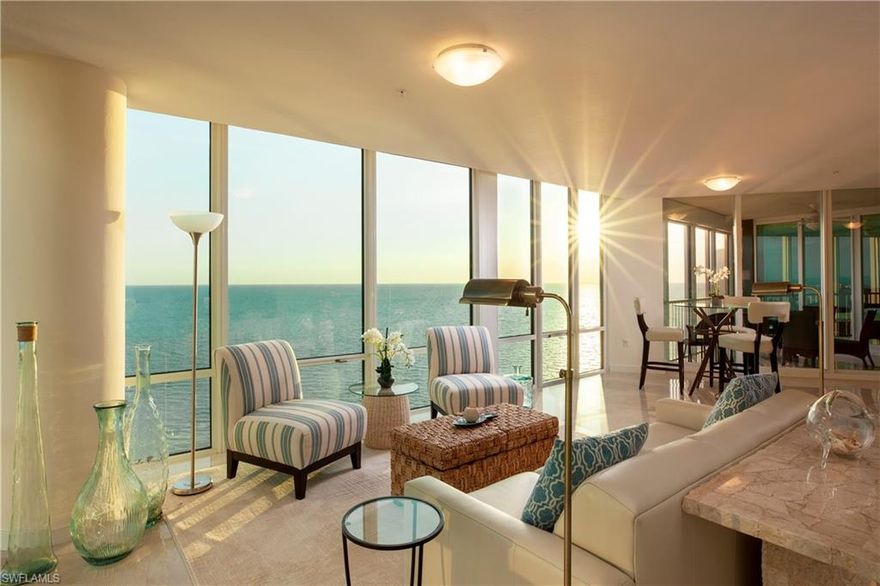 Imagine walking into this extraordinary panoramic view of the Gulf, with floor to ceiling glass windows. You will feel like you are on a luxury cruise ship looking out at an endless water view of the Gulf of Mexico. Marble flooring throughout the home enhancing the tropical furnishings and decorations make this home true luxury living. The bright and light kitchen has custom handles, island with breakfast bar, built-in desk, and white appliances. The eat-in kitchen area is nestled in the custom curved wall design and provides a beautiful view of the bay and Gulf. The master suite has unobstructed ocean views and access to the balcony. The en-suite boasts dual sinks, a large soaking tub, enclosed private water closet, bidet, and Corian countertops. The guest suite is looking over the bay with panoramic glass views, a sitting area, and a private bath. The den/bedroom has a custom built-in desk and access to the balcony. This penthouse lives like a private luxury home with the amenities of Le Ciel Park Tower. Private pool and spa overlooking the beach, fitness center, outdoor kitchen, and Tennis.