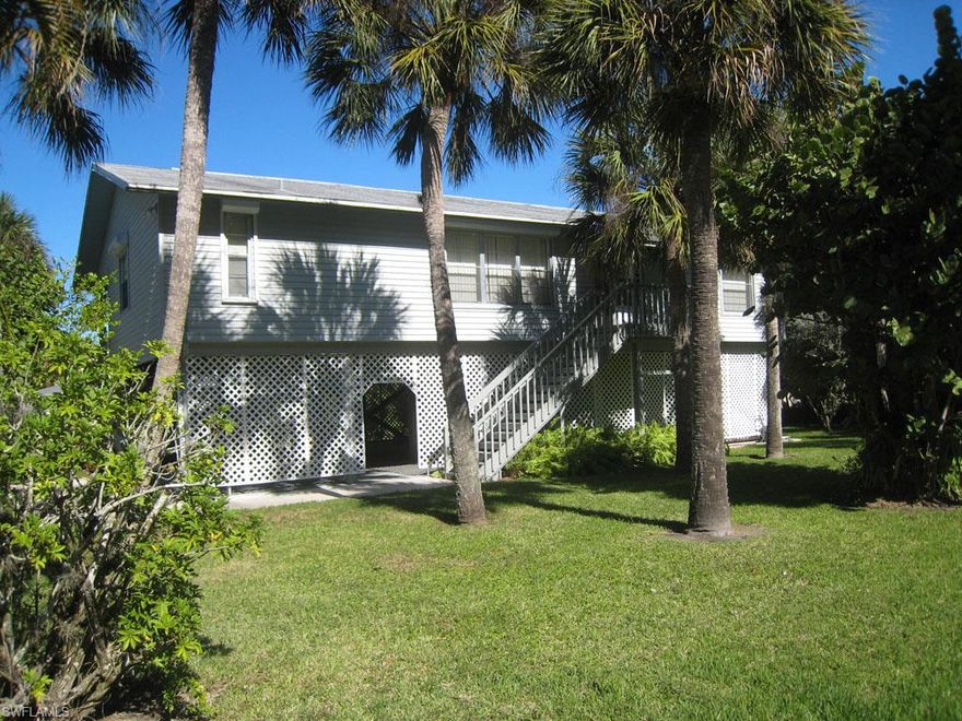 This welcoming home is centrally located and close to all Island amenities.
Delightful piling home with three spacious bedrooms, split floor plan, large lot,  screened porch and large workshop/storage/parking on ground level of the home.  Built by the original
owners, it has been lovingly cared for and beautifully maintained.  Ready for a new family, it is the perfect solution to Island living! This is an "As Is" Sale. Wheelchair lift is not warranted.