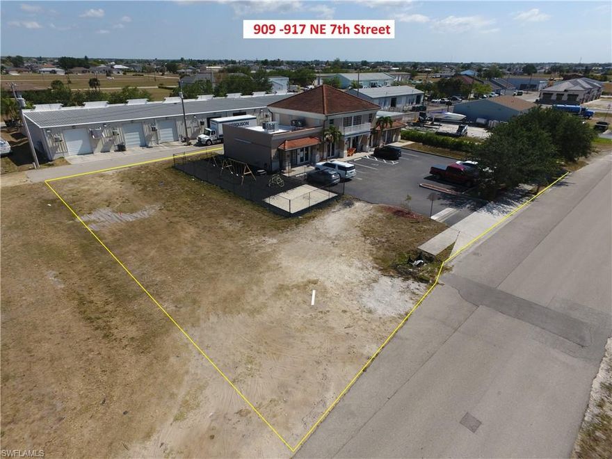 This could be a good investment opportunity - a well built 3,680 square foot commercial building on 21,875 sf of land (7 lots). Current tenant is a day care operator and has been in this location since August 2016. Building is divisible, has 4 ADA compliant lavatories, water heater, mop sink, kitchen area, several windows with plenty of natural light, 18' ceilings in the center section of building, multiple entrances, private parking lot and alley access. New roof coating applied in 2023, 8 new exterior doors in 2025 along with new HVAC systems. Building can be modified to add a second floor of approximately 1,500 square feet if needed. Also includes a fenced side yard used as an outside playground space (lot 56) plus two additional lots are included in the sale, lots 57 and 58 to the west.