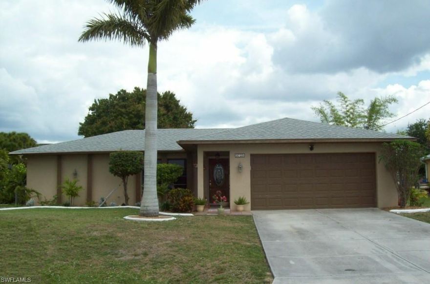 A Gem in Paradise! Check out this LOVELY, updated FOUR BEDROOM home in the heart of Cape Coral close to excellent schools, health care, shopping, and dining. City utilities~~ALL ASSESSMENTS PAID! Gorgeously remodeled kitchen features granite counters, newer stainless appliances, and raised-panel wood cabinets with crown molding. Walk-in closets in every bedroom. New hardwood floors throughout; tile in kitchen. Remodeled bathrooms. Wired for surround sound. New tubs, toilets, & fixtures. Washer & dryer included. A/C 2011; Roof 2004. Pocketing sliders lead to the lanai under truss. Enjoy the spacious front yard with decorative concrete curbing and the completely FENCED back yard with plenty of room for your pool. Family-friendly neighborhood of well-kept homes offers easy access to anywhere in Cape Coral or Fort Myers. This is a nice solid house at the right price--Clean, Refurbished, and Move-in ready! AGENTS--bring your most particular buyers--you will not be disappointed!