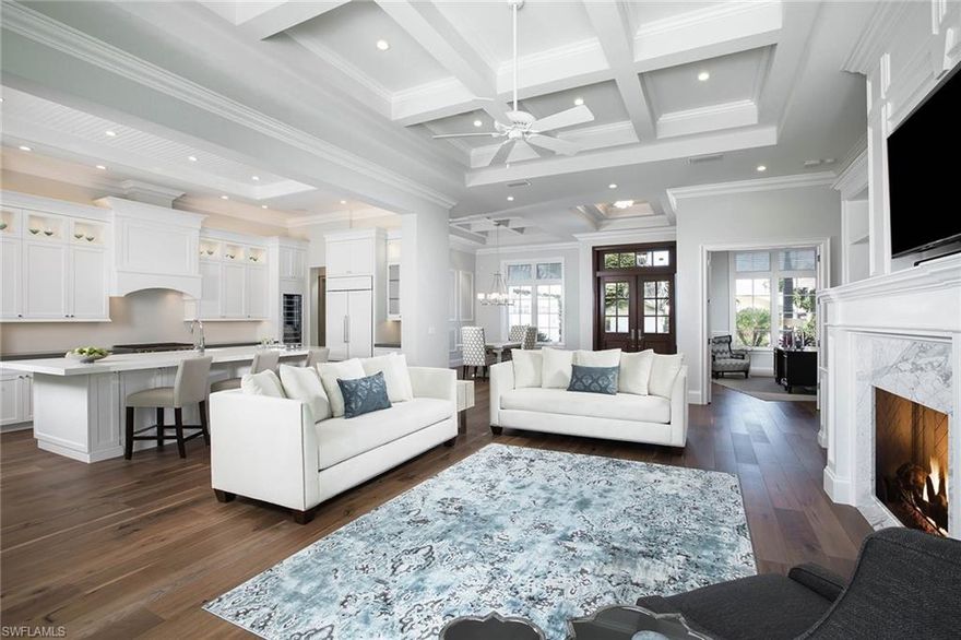 Coastal contemporary design and clean lines define this beautiful British West Indies-style home. Showcasing meticulous attention to detail, this sophisticated residence features volume ceilings, custom woodwork and hardwood floors throughout. Perfect for gourmet meals, the light and bright kitchen includes an island and walk-in pantry. A luxurious master suite, second master suite and a spacious great room with fireplace are found on the main floor. Ten-foot sliding glass doors invite the outdoors in and open up to a tropical oasis with sparkling pool, fountain and spa. Ideal for guests, the private upstairs offers three en-suite bedrooms, family room and wet bar. Owners will enjoy the close proximity to Park Shore beach access and The Village at Venetian Bay. As a Park Shore resident, voluntary membership to the private Park Shore Association is available.