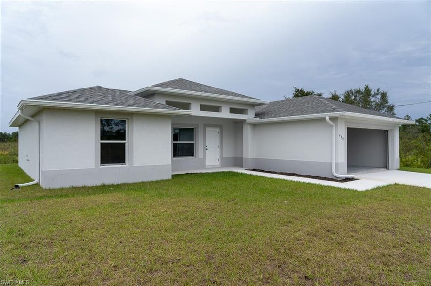 Step into a world of modern elegance with this brand-new construction home, perfectly situated in the lively and growing community of Lehigh Acres! Spanning a generous 1,200 square feet of thoughtfully designed living space, this residence transforms everyday moments into pure joy. Discover 3 inviting bedrooms—including a luxurious primary suite with ample room to unwind—alongside 2 immaculate bathrooms. Highlights include sleek tile flooring throughout, LED lighting that brightens every corner, abundant natural light pouring in from large windows, a spacious driveway for easy parking, and a expansive backyard ideal for outdoor gatherings, gardening, or simply soaking up the Florida sun. At the center of it all is a gourmet kitchen equipped with premium stainless-steel appliances, perfect for whipping up family meals or entertaining guests. The open-concept living areas blend minimalist sophistication with warm, cozy vibes, creating a serene retreat where relaxation comes naturally. Just minutes from schools, convenient supermarkets, and major highways for effortless commuting. Embrace a seamless lifestyle with all essentials right at your doorstep. This turnkey home comes fully equipped with all major appliances, including a refrigerator, stove, dishwasher, microwave, washer, and dryer connections. Don't miss your chance to make this dream your reality—welcome home!