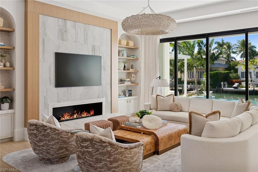 This is the one you have been waiting for. A rare, custom built new construction residence showcasing timeless features and bespoke finishes, set within the highly sought-after Aqualane Shores, one of Naples’ most prestigious enclaves.
 
Highlights include a first-floor primary wing with a spa inspired bath, an inviting waterside lounge and bar, and extraordinary outdoor living spaces overlooking wide western exposure canal views. Designed by the celebrated team at Amy Storm and Company, envisioned by renowned architect Jon Kukk, and expertly executed by C&E Builders, this luxury residence exudes effortless sophistication. Natural materials and serene, layered neutral tones are thoughtfully integrated throughout, creating a timeless aesthetic that complements any design style.
 
An elevator provides seamless access to every level, enhancing everyday living. Inside, bright and airy interiors are complemented by wide plank white oak floors, adding warmth and refined elegance throughout. The gourmet kitchen is a chef’s dream, showcasing a custom stone hood, a La Cornue range, top-tier appliances, and a butler’s pantry.
Step outside to your private oasis, where an expansive lanai is designed for entertaining and features a fully equipped outdoor kitchen, fireplace, and generous gathering space. Relax by the sparkling pool and spa, unwind beneath the pergola with a daybed, or gather around the fire pit under the stars - creating an inviting setting for memorable evenings.
For tech enthusiasts, the home is equipped with a state-of-the-art, high end AV system that delivers an immersive entertainment experience throughout the residence. Boaters will appreciate the direct Gulf access, making this a true waterfront retreat. Ideally located just moments from Naples’ pristine beaches, along with the world-class shopping and dining of 3rd Street South and 5th Avenue South, this home offers the perfect balance of luxury, convenience, and serene coastal living. This exceptional residence must be seen to be truly appreciated.