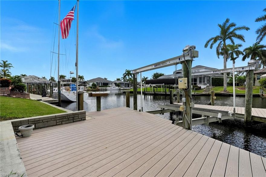 Rare opportunity with seller financing available in one of Cape Coral’s most desirable waterfront locations. This direct sailboat-access property features southern exposure, no bridges, and quick access to open water. Positioned just steps from Cape Harbour and surrounded by luxury waterfront communities, it’s ideal for boaters, investors, or anyone planning a future custom home.

The existing 3-bedroom, 2-bath home was impacted by Hurricane Ian but has been professionally remediated, providing a clean slate for renovation. The home will need new drywall throughout, but major systems remain functional, allowing for a variety of paths forward. Buyers can redrywall and install a new appliance package to live in or rent, renovate for long- or short-term rental income, or clear the lot and build new. I have partnered with Windward Construction, a premier local builder, to showcase new-build possibilities for this lot, though there is no obligation to use them.

Boaters will appreciate the deep-water canal, wide turning basin, and two boat lifts (13,000 lb with 32' slip and 10,000 lb with 19' slip). The property also includes a spacious screened pool area, mature landscaping, and intersecting canal views.

Recent updates include a new roof installed in 2022 with premium shingles, a newer pool pump, hot water heater, dock improvements, and updated irrigation valves. The location places you minutes from Cape Harbour, Tarpon Point, marinas, waterfront restaurants, live music, boutique shops, golf, and new developments such as Bimini Square and The Cove.

Whether you choose to renovate, generate income, or build a custom waterfront home, this property offers exceptional location, flexibility, and long-term potential in one of Cape Coral’s premier boating neighborhoods.