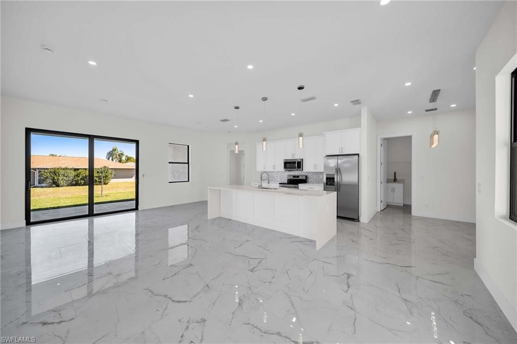 Photo of 311 NW 4th ST, CAPE CORAL, FL 33993 (MLS # 225082917)