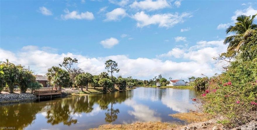 This 3 bedroom, 2 bath, pool home is the jewel of the neighborhood!  Located in Golden Gate City with a spectacular view at the intersection of 2 canals.  The open floor plan, high ceilings, and lots of windows give this home a light and lovely feel. The bathroom and kitchen were completely remodeled in 2018. The upgraded kitchen has striking dark cabinets, black appliances, and marble countertops.  The pool and spa area is surrounded by wrought iron fence - great for relaxing and entertaining.  Great schools, close to shopping, restaurants, and entertainment.