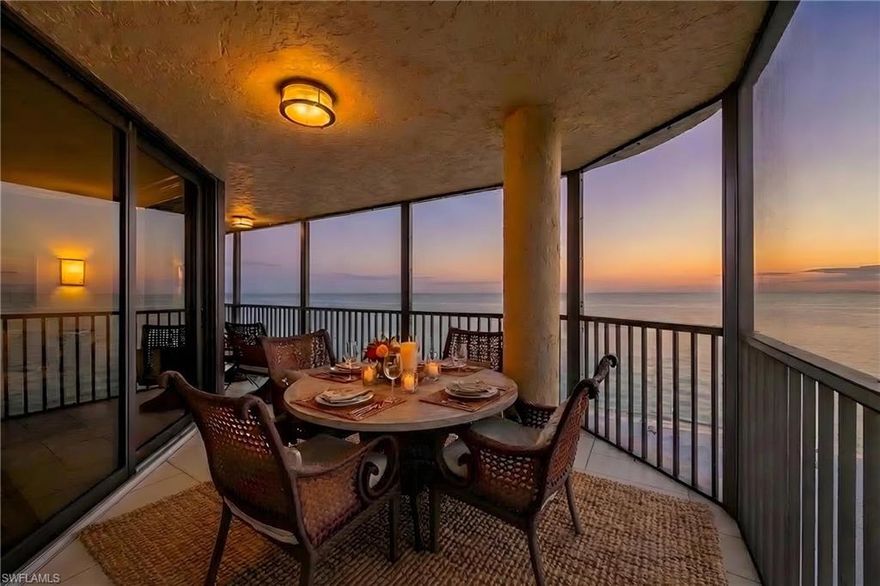 Experience breathtaking Gulf-to-bay living from this stunning beachfront residence on Vanderbilt Beach. Perfectly positioned to capture both spectacular sunsets over the Gulf of Mexico and sparkling morning light across Vanderbilt Bay, this beautifully updated condominium offers panoramic water views from nearly every room.

Expansive floor-to-ceiling glass fills the residence with natural light while framing the endless blue horizon. The open living and dining areas flow effortlessly to a spacious wraparound lanai overlooking the beach, an extraordinary setting for sunset cocktails, outdoor dining, and relaxing to the sound of the waves.

The renovated kitchen blends style and function with custom cabinetry, granite countertops, stainless steel appliances, and a generous workspace that opens seamlessly to the main living areas, ideal for entertaining.

Wake each morning to Gulf views from the spacious primary suite, which offers lanai access and a beautifully updated bath with dual vanities and a large glass-enclosed shower. Two additional guest bedrooms provide comfortable accommodations for family and visitors, each with well-appointed baths and abundant natural light.

Additional highlights include a full laundry room, generous storage, and a well-designed layout that lives comfortably for both full-time residents and seasonal enjoyment.

Located directly on Vanderbilt Beach, residents enjoy immediate access to one of Naples’ most coveted stretches of sugar-sand shoreline and are just minutes from The Ritz-Carlton Beach Resort, Mercato, and some of Naples’ finest dining, shopping, and entertainment.