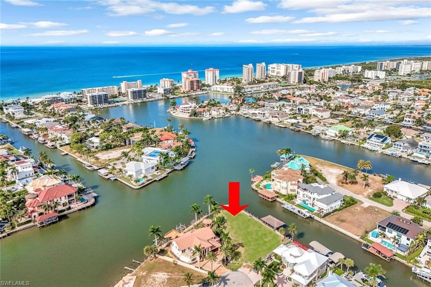 A once in a generation opportunity to own this exceptional point lot in Vanderbilt Conners! One of the largest waterfront parcels in the entire community with double the size of a typical lot. Commanding over 180 ft of sparkling water views. This exceptional .45 half-acre point lot delivers wide bay views, unmatched privacy, scale, and design potential. This wraparound waterfront lot has a “grandfathered in” boathouse which will not impede your views from your future home.  Also additional water frontage for expansive dock that becomes a true extension of your backyard or for additional vessels. Perfectly located at the end of a quiet cul-de-sac offering sparkling water views with a peaceful backdrop of intersecting waterways, palm trees and amazing sunsets!
Direct Gulf access coupled with spectacular sunsets in the Western skyline making it a dream setting for boating enthusiasts and waterfront visionaries alike.
Walkable coastal lifestyle at Vanderbilt Beach, enjoy The Ritz Carlton, La Playa Beach & Golf Resort, New Center with 8 Har-Tru tennis courts and 20 pickleball courts, Whole Foods and Mercato’s premier dining and shopping.
Unparalleled lifestyle conveniently located to the beach, the Ritz-Carlton, Mercato Shops, La Playa Beach club, public tennis courts and 20 pickleball courts plus plethora of dining options including beachfront dining at the Turtle Club, Baleen and the Ritz-Carlton’s Dusk and Gumbo Limbo. 
Fully engineered plans by award winning MHk Architech could be available. This offers a combination of time savings and accelerated build potential a tremendous advantage for any homeowner looking to begin their custom masterpiece immediately.