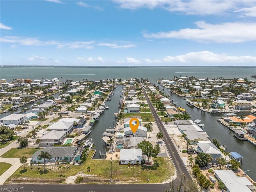 DIRECT GULF ACCESS! Your slice of paradise awaits in this completely renovated waterfront home, located on an oversized corner lot in desirable St. James City. This 2BR, 2BA Pine Island Shores home has been updated from top to bottom, offering peace of mind and effortless island living.
Step inside to find new flooring throughout, a new kitchen featuring stylish cabinetry, fixtures, and appliances, and fully renovated bathrooms with new tubs, showers, cabinets, and fixtures. Enjoy additional upgrades including a newer metal roof, new AC, new septic tank, new tankless water heater, new washer and dryer, new garage door, and an updated laundry room.
Relax in the bright Florida room overlooking the canal, or head outside where this property truly shines. Boaters will love the 10,000 lb boat lift, composite dock, and concrete patio area, complete with electric and water at the dock. From here, you’ll enjoy direct access to San Carlos Bay, Matlacha Pass, Pine Island Sound, and the Gulf of Mexico—ideal for world-class fishing, cruising, and exploring the islands.
This affordable move-in-ready home would make the perfect fish camp!! Schedule your showing today!