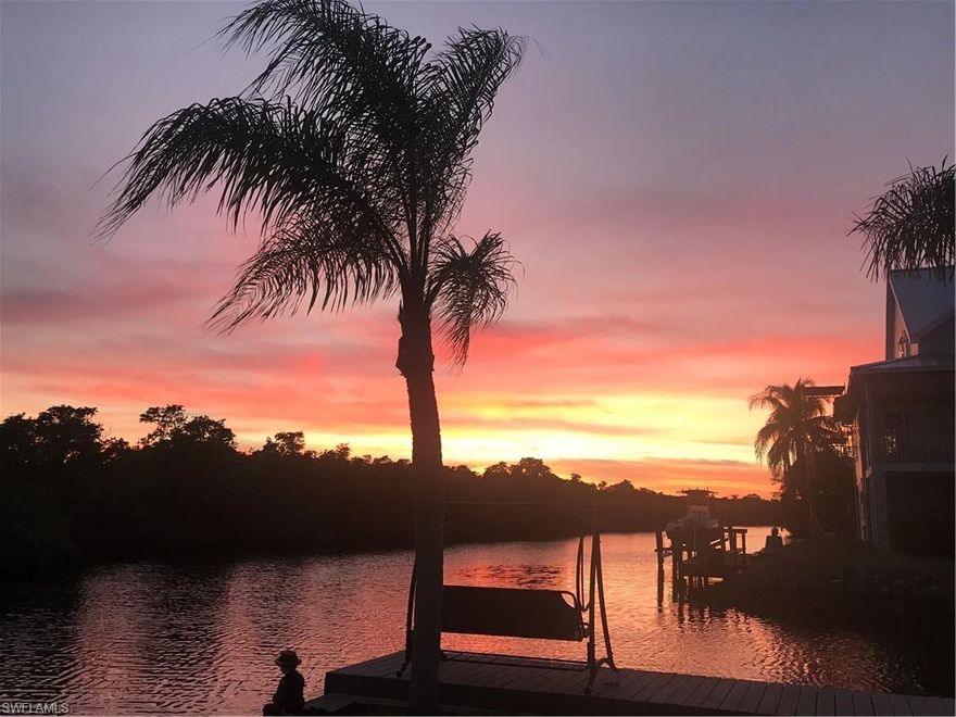 Experience the pinnacle of waterfront living on this extraordinary Gulf access point lot with over 200 feet of pristine waterfront that gracefully wraps around the property. With two private boat docks, 13,000 lb lift, and a personal ramp, this extraordinary offering provides everything you need to live your dream waterfront lifestyle!
Enjoy incredible breathtaking water views stretching down the sparkling waterway, where breathtaking sunsets paint the horizon each evening. The coveted southern exposure is perfect for designing a sun-drenched pool and outdoor living space that capture the Naples dream. 
Set on a quiet cul-de-sac, this extended homesite offers an unmatched opportunity to create your custom coastal retreat, complete with open-air lanais overlooking tranquil preserve and mangrove vistas. From your backyard, enjoy effortless boating adventures through unspoiled mangrove estuaries to Wiggins Pass and the Gulf. 
Ideally located west of 41, you’ll find yourself a bike ride from several fun and casual dining options, shopping including new super Publix and white sugar sand beaches with sidewalks leading the way. 
Whether envisioned as a full-time residence or a seasonal escape, this exceptional property delivers the ultimate Naples waterfront experience—a blend of privacy and endless possibility.
Enhance your Naples lifestyle with an optional membership at the nearby Tarpon Cove Yacht & Racquet Club, offering tennis, bocce, a pro shop, dining, clubhouse, and even a boat shuttle to the beach.
No HOA fees—just pure relaxed coastal living in one of Naples’ most desirable waterfront communities.