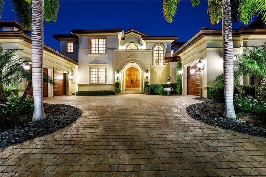 This spectacular Aqualane Shores residence offers convenient access to Naples' famous sugar sand beaches and Third Street South cultural district while also providing direct, Gulf access right from the backyard. Located on wide water Heron Cove, enjoy bridge-free boating with an 80ft dock and separate boat and jet ski lifts. At over 5,500 sqft, this exquisite home features a first-floor master suite, 3 additional guest bedrooms (all ensuite with balcony access), a den, formal living and dining rooms, and 2 family rooms. Chef's dream kitchen features two large islands, high-end appliances including a gas Wolf range, and plentiful custom cabinetry. Ideal for entertaining family and friends. Enjoy western sunset views from the spacious covered lanai with automatic screens, a summer kitchen, and saltwater negative edge pool and spa. This is truly a boater's paradise!