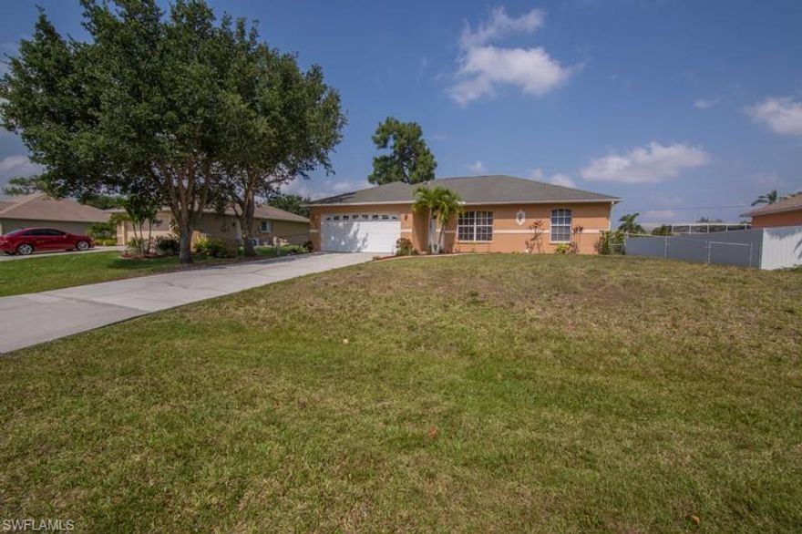 This well maintained home is tiled thru-out and much more spacious than one would think.  The sewer & water assessments are in & PAID - saving you over 12 thousand dollars! This home has a great layout with a family room, eat-in kitchen & bar open to living area & a family dining area that could be enclosed for an office or playroom.  The split bedroom plan allows privacy, and the two guest bedrooms both open into a Jack n Jill bath which is also accessible from the main living area. You will find Curbing around the front flower beds and an over-sized fenced backyard. The A/C and water heater is less than two years old -  NOT in a Special Flood Hazard zone - no  Flood Hazard insurance needed!!  don't miss out on this one!!