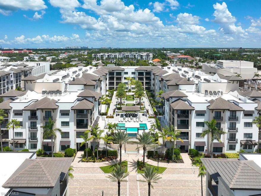 Gracious interior with an expansive patio. Located in one of the most desirable units within Naples Square III, this sought-after Chatham floor plan showcases an exceptional pool-deck–level terrace overlooking the beautifully landscaped courtyard—ideal for effortless indoor-outdoor living. Offered fully furnished and west-facing, the residence is highlighted by a full NanaWall of sliding glass doors, filling the home with natural light and creating a seamless connection to the expansive terrace. The thoughtfully designed center-island kitchen features premium Bosch appliances, sleek custom cabinetry, generous storage, and curated designer finishes that complement the unit's modern coastal architecture. A flexible den with a barn door and Murphy bed functions comfortably as a third bedroom when needed, while the split-bedroom layout ensures privacy. The spacious primary suite includes dual closets and a refined bath with double vanities, a glass-enclosed shower, and a soaking tub. A well-appointed ensuite guest bedroom and a large laundry room with abundant cabinetry further enhance everyday convenience. Naples Square residents enjoy an impressive collection of resort-style amenities, including a sun-splashed pool and spa, inviting fire pit lounges, a covered outdoor grilling pavilion, an elegant club room with billiards, and a state-of-the-art fitness center. All just steps from the shops and restaurants of 5th Avenue S, the beach, and the farmers market and dining along 3rd Street S, this residence delivers refined luxury and walkable downtown living at its best.