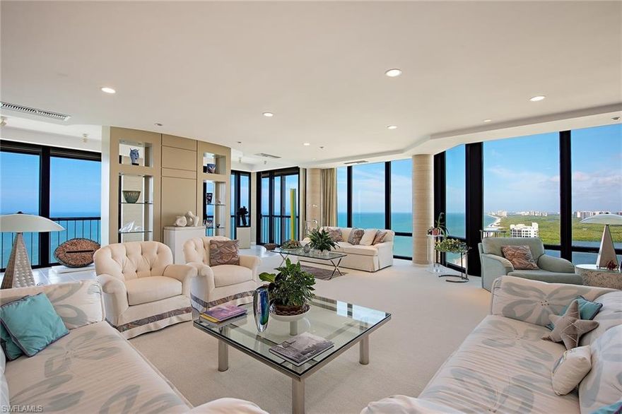 Magnificent Penthouse with sweeping Gulf views. Views all the way to Sanibel Island. Floor-to-Ceiling glass and clean contemporary lines. 6428 square feet under air. Features 5 bedrooms, all en suite and all with walk-in closets. Powder room. Library/office with custom built-ins. Formal dining room adjacent to wet bar and wine room. Large, open kitchen with morning room. This Penthouse has its own private 2 1/2 car garage with storage. Le Parc features a beachfront pool and spa, a modern fitness facility, sauna facilities inside and out, a Har-Tru tennis court and a large, well-appointed social room. Private location at the end of Gulf Shore Boulevard. Walk to Venetian Village shops and restaurants.