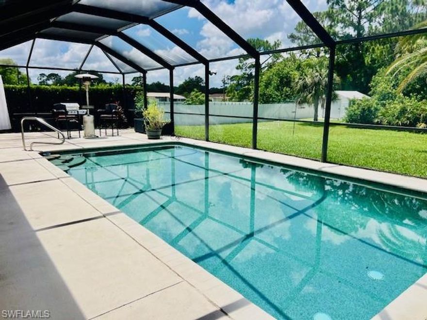 This immaculate three-bedroom, two-and-a-half-bathroom residence is situated on a pristine half-acre lot in tranquil Lehigh Acres, FL. The property features tile flooring throughout, three sets of pocket sliders leading out to a spacious lanai and pool. Two master suites are included. The incredible Icynene insulation ensures this property is both green and super efficient, resulting in notably low electric bills. This residence also features a brand-new roof installed in 2023.