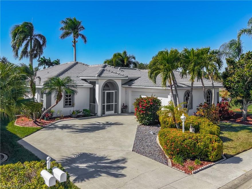 Imagine your favorite neighborhood bar just steps from your living room, perched on your lanai with sweeping views of a shimmering lake and palm trees with the golf course beyond. This beloved LaScala home in Herons Glen Country Club makes entertaining effortless with its custom lanai bar that's become the heart of countless gatherings and stunning sunset celebrations. Perfectly positioned near the front gate for convenient access yet just a quick golf cart ride to the clubhouse, restaurant, pool and pro shop, this turnkey residence offers the ideal balance of privacy and community connection. The thoughtfully maintained interior features newer laminate and tile flooring throughout, bright white cabinetry paired with Corian counters and a double undermount sink in the kitchen, and heavy-duty washer and dryer ready for your arrival. Recent updates include a roof installed in late 2022, ensuring years of worry-free enjoyment ahead. The spacious lot provides extra breathing room with no neighbor on one side, while the full two-car garage with a curved driveway adds both functionality and curb appeal. Your purchase includes a golf cart equipped with two-year-old batteries and mag wheels, making it easy to embrace the active lifestyle this community is known for. Whether you're drawn to the unbeatable lake and golf course views, the proximity to world-class amenities, or that amazing outdoor bar where friends old and new can gather at your own private 19th hole, this cherished retreat is ready to become your new favorite escape.