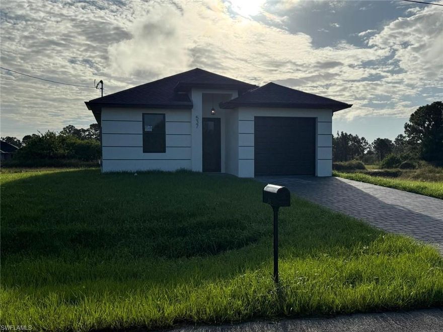 New Construction Home truly a must see ! Seller will contribute to closing cost !!! READY to MOVE IN. Beautiful 3 bedroom 2 bathroom home, located in a fast growing area in Lehigh Acres with canal. This home has an OPEN floor plan, porcelain tile floors throughout the entire home, stainless steel appliances, Impact window and doors. Beautiful white cabinets and QUARTZ counter tops. Schedule your showing today and come see this beautiful home!