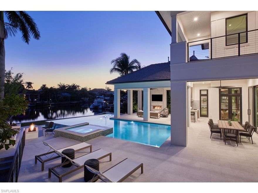 A new construction opportunity, impressively situated in Aqualane Shores, boasting southwestern views overlooking the vast waters of Kite Cove. British West Indies architecture infused with contemporary elegance and Old Florida Charm. A stunning home designed by Stofft Cooney Architects & Adelyn Charles Interiors and constructed by the reputable craftsmen at EECON Construction Services. This appealing Smart Home will feature Feil European white oak flooring throughout and a floating staircase to match, high-quality millwork, handcrafted DKS cabinetry, and impact-resistant windows and doors. The separate dining room has a temperature-controlled wine vault. Enjoy the well-appointed Chef's kitchen that opens to the grand living area with dazzling water views. Five-bay collectors garage. Superb location - a stone's throw to the beach and the celebrated upscale shops and restaurants of Downtown Naples' Third Street South. Fully furnished by Adelyn Charles Interiors. Estimated Completion Early 2021.