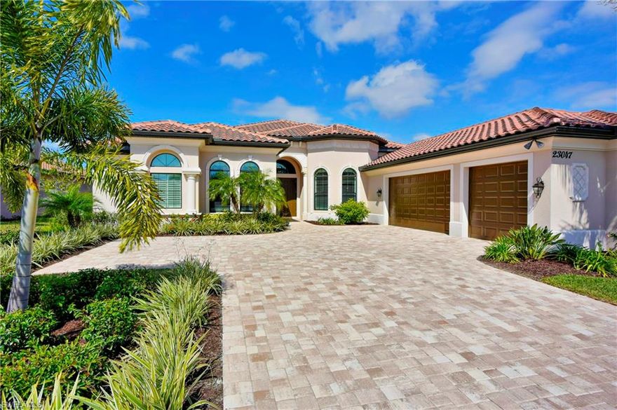 Beautiful estate home! offering an open floor plan with soaring ceilings. The main living area offers hardwood throughout to greet your guests with a spacious tray ceiling with decorated crown molding in the family room . 4 large sliders that pocket, a salt water heated pool and spa with decorative tile& a expansive Lanai with pavers. The kitchen features custom cabinetry, granite counter tops &  stainless steel appliances, including a 4 burner gas cook top and a large double basin sink. All bedrooms have upgraded carpeted flooring. The master bedroom is very spacious with sliders leading to the pool area, trayed ceiling & crown molding. Additionally, one walk in closet, one upgraded custom closet and a private toilet area,with each bedroom having a private bathroom. A powder room, laundry room and 3 car garage that is complimented by two 8 ft garage doors. The home has been beautifully painted throughout with a spectacular lighting package, hurricane impact windows & doors, surround sound installed speakers, wall sconces built into the niche's in dining room. Outside you will notice the mature landscaping, this home sits on a beautiful lake front lot in this beautiful development.