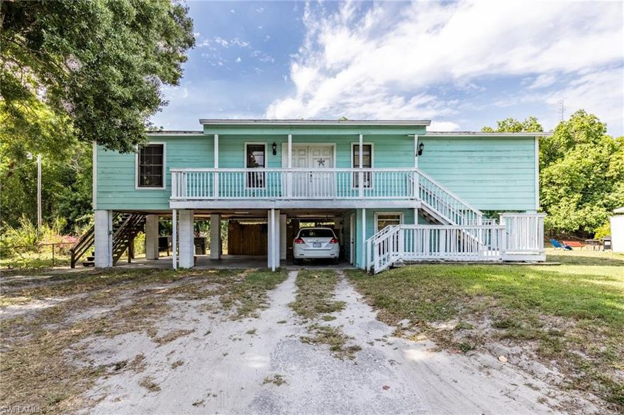 Flexible OPPORTUNITY- perfect for extended family with a 1bed/1bath in law suite below.  2bed/2bath spacious stilt home with vaulted ceilings, and updates throughout- laminate flooring, updated baths and kitchen, dedicated laundry room, front and rear deck.  Downstairs is a 1bed/1 bath.  Each has their own washer/dryer.  Roof and septic tank are both 2014.  3 bay carport with lots of storage.  Very close the the Edison Bridge on cul de sac street, ideal NFM location!