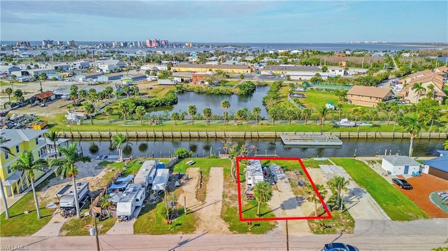 Enjoy Old Florida Charm on San Carlos Island, un-incorporated Fort Myers Beach. A boater's dream, this waterfront lot leads right out to the the bay and gulf waters where you'll enjoy the sun whether you're fishing or cruising. Traditional home builds or manufactured homes are allowed on Oak Street. Post hurricane, the lot is currently set up with electric, sewer and water for two temporary RV's for rental income. The lots on both sides are also available for purchase with the same set-up. San Carlos Island is home to Southwest Florida's commercial shrimp fleet and other local fishing boats that bring in the areas delicious fresh seafood! This is a great community of long time locals, seasonal residents and visitors from all over. Down the road is the Key West Express, wet & dry boat storage, boat charters, marinas, great restaurants such as Bonita Bills Waterfront Cafe, Doc Fords, Dixie Fish, Parrot Key, and more coming. Right over the Matanzas Pass bridge is the sandy white beach & more fun. Hurricane Pass bridge leads you to Sanibel/Captiva, Downtown Fort Myers, or anywhere else you want to go. There is no place like this place. You and your guests are going to love it here!