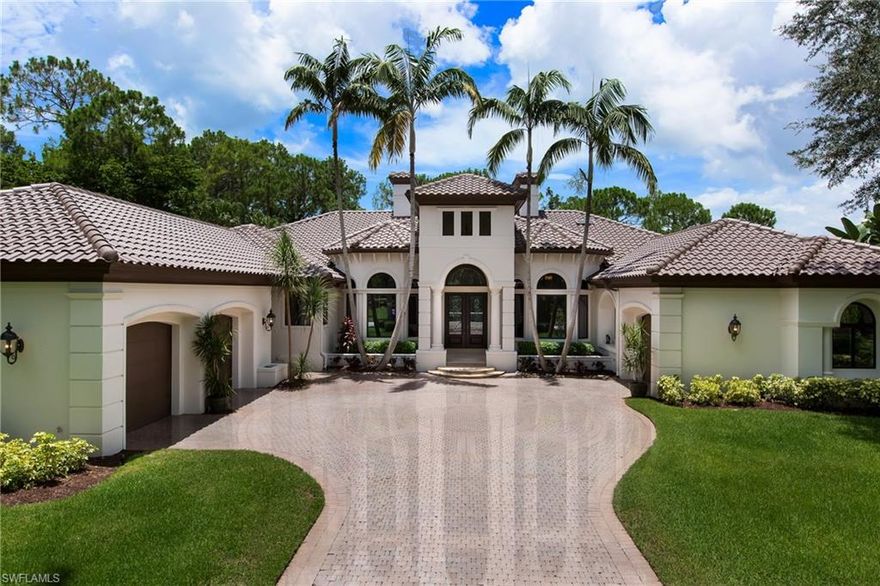 H.12094 – WOW! WOW! WOW! Gorgeous estate home has been totally redone both inside and out!  The transformation is unbelievable!!! You are greeted by the gracious living room with 2-story fireplace, formal dining room, and private office.  The butler’s pantry & wine room lead the way to the spacious Chef’s kitchen. The white kitchen is done with the most current look and finishes!!  Masterfully crafted and updated family room opens to covered lanai and summer kitchen.  3 freshly painted guest suites with new carpeting, celling fans & walk-ins. The Owners Wing is simply stunning which includes a separate sitting room, 2 large walk-ins and a spa-like bath that overlooks the garden water wall. There are so many places to enjoy outside as well.  Thoughtful design and spacious resort-size lanai, fountain and pool provides countless places to relax and soak up the sun. Freshly landscaped & painted outside make the curb appeal outstanding!  Split garages with epoxy flooring and custom built-ins provide additional storage as well. The amazing privacy of this SW exposure lot captures, the golf course view, glistening lake and preserve settings!! Don’t miss this opportunity to call this home!