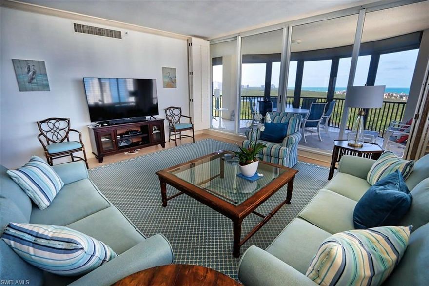 Marquesa...Enjoy this elegant building located in the private gated community of Bay Colony. This 12th floor, 3 bedroom, den, 3 bath residence overlooks the beauty of the Pelican Bay preserve with long views of the beach and coastline west, north and south! This quiet location offers a full range of amenities, including fitness, a large pool, spa and poolside grill. As a guest in the Marquesa, you have access to the tennis center, and also private Beach Club at Bay Colony, offering fine and casual dining, as well as a beachside pool with lounge service and light fare. The den offers a queen pull- out couch, flat screen TV, and a full bath. A beautiful kitchen with Corian counters, quality appliances, and a sitting area with dining for 6. Throughout this property you will find marble flooring, attractive furnishings for comfort and entertaining. Enjoy a beautiful sunset on the screened lanai, which is fully furnished for relaxing and dining; an east, morning view is perfect for your morning coffee. So close to the shops, restaurants and galleries at Waterside shops, Venetian Village; a short drive to 5th Ave., and Third Street.