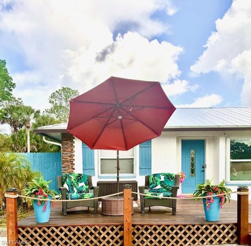 Escape to your own private paradise on this stunning, fully fenced 2.5-acre ranch estate, surrounded by mature, swaying palm trees. This property is an entertainer's dream, featuring an in-ground pool, screened lanai, and two massive decks designed for hosting, complete with an outdoor bar. The main ranch-style home offers spacious, comfortable living. The property boasts a fully functional, detached 1-bedroom, 1-bathroom mother-in-law suite—including its own kitchen and laundry—offering perfect privacy for guests, multi-generational living, or rental potential. Additional features include a detached garage, new metal roof (2025), NO HOA,  multiple storage sheds, and a specialized air-conditioned shed with full electric power—ideal for a workshop or home office. Live the Florida lifestyle you've dreamed of while enjoying the endless and amazing sunsets!