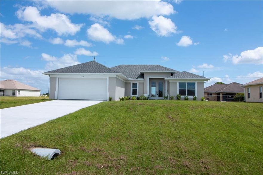 Brand new construction in NW Cape Coral. The modern and open layout makes this home great for entertaining. Built with a two-car garage that has easy access to the laundry room. The three-bedroom layout is ideal for raising a family in a spacious setting. This new construction home has been built with every detail in mind, from the 8 FT double doors at the entrance to the 10 FT tray ceilings that add a unique touch to the home. The grand master bedroom provides you with a view to the backyard and the master bath is perfect for a couple in need of double sinks and shower. Not to mention the vast walk-in closet! All lights in main areas were placed with LED Lighting to provide optimum power efficiency. Granite countertops have been installed throughout the entire kitchen and all bathrooms. The kitchen also has brand new stainless steel appliances that go great with the homes color scheme. This same model is also offered in other locations throughout the Cape. Schedule your showing today to view this one of a kind home!
