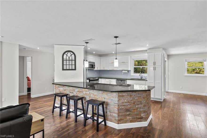 AVAILABLE FOR RENT IN JULY 2026! UNFURNISHED; LONG TERM RENTERS PREFERRED. PETS OKAY FOR ADDITIONAL FEE. This single-family residence offers three bedrooms, two full baths, a large eat-in kitchen, and spacious living and dining areas. The fully-renovated home boasts custom stonework, laminate flooring throughout, stainless steel appliances, glass tile backsplash, built-in breakfast nook with storage, and custom cabinets. The primary suite features a walk-in closet, a jetted tub, a dimmable LED mirror with a defogging setting, dual sinks, and a shower with two showerheads. Upgrades include whole-house water softener, reverse osmosis drinking water, storm-proof windows and sliding doors. Outside is a fenced-in backyard. (PLEASE NOTE: all areas of the yard outside the fence are EXCLUDED from the rental, including tool shed and detached workshop.) The home is conveniently located two miles east of Collier Blvd, five minutes from Publix and within walking distance of Max Hasse Community Park.