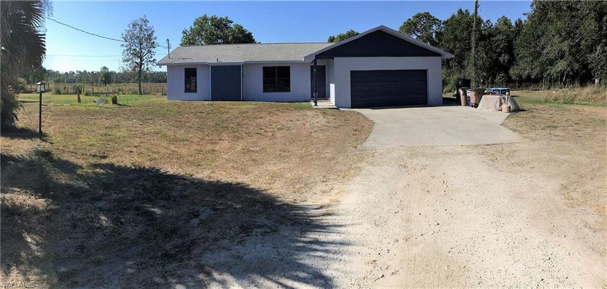 Amazing 5 acre property with 3 bedroom and 2 bath home on it.  The home has been painted inside and out.  Newer flooring, Roof was put on in 2012.  The land backs up to County owned land.
