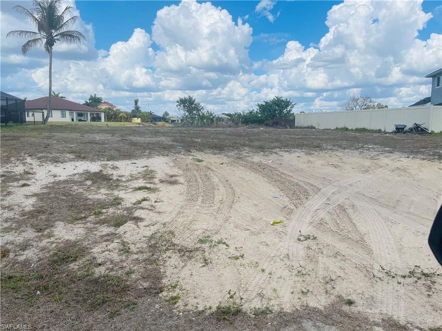 Beautiful lot overlooking a fresh water lake, and is only half mile to the high School.  Shopping and grocery stores are within two miles.  Water, sewer and irrigation is already in the neighborhood and all assessments have been paid.  There is no seawall.  The lot line across the back is eighty seven ft.  Additional photos to follow.