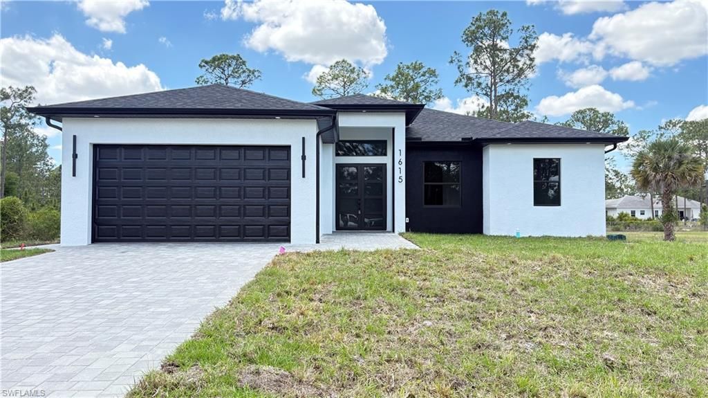 Photo of 1615 Plumosa AVE, LEHIGH ACRES, FL 33972 (MLS # 226014040)