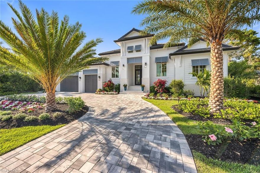 On one of the most desirable streets in Park Shore, this exquisite residence by Lutgert Custom Homes is the epitome of luxury. Boasting a refined coastal design aesthetic, the attention to detail is certain to impress even the most discerning buyer. Beautifully appointed finishes and selections by Soco Interiors abound. Expansive walls of glass allow for a seamless extension of luxury living space. The professionally designed landscaping creates the ideal canvas for the stunning resort-inspired outdoor living area. Complete with innumerable features including  saline pool and spa, loggia with summer kitchen and gas fireplace. This location could not be more ideal, with proximity to myriad shopping, dining and cultural offerings, as well as a private beach access and boat slips available for purchase exclusively for Park Shore residents.