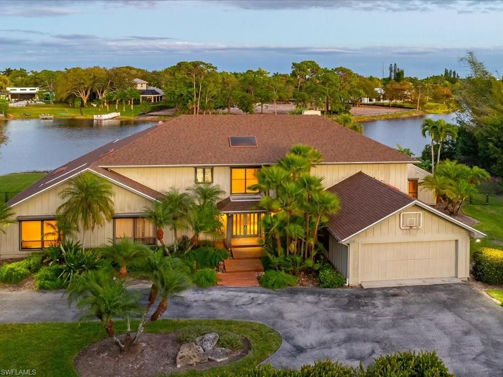 Photo of 154 Cajeput DR, NAPLES, FL 34108 (MLS # 226003561)