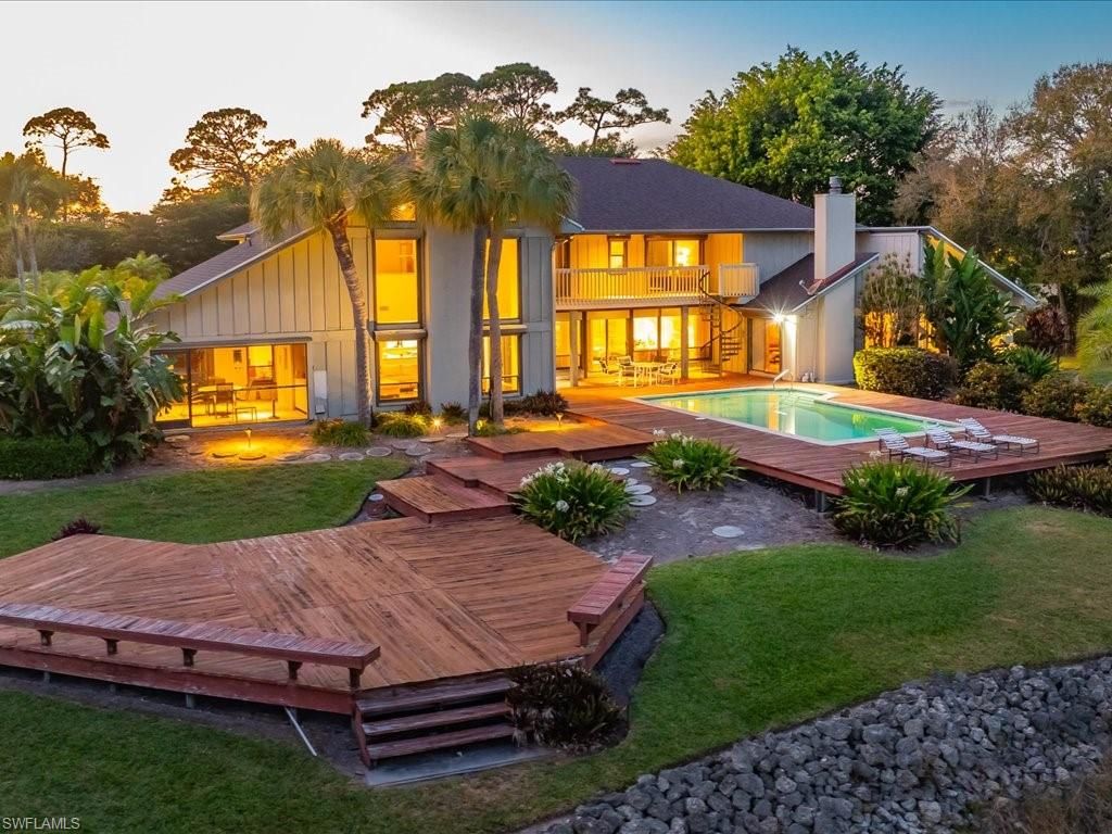 Photo of 154 Cajeput DR, NAPLES, FL 34108 (MLS # 226003561)