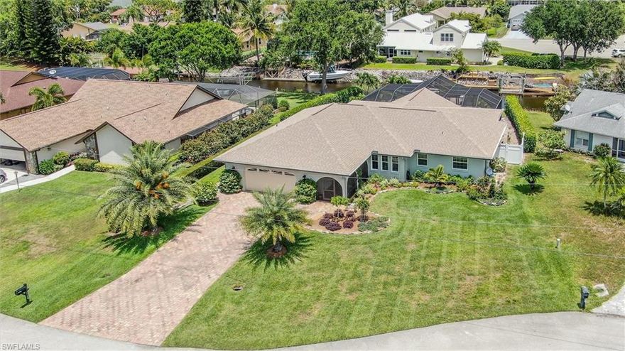 Rare listing in a highly desirable area. Small, secluded boating community of 27 homes is bounded by 8000+ acre state park and the Estero river. Centrally located, this direct Gulf access home is situated on a quiet cul-de-sac that has easy access to major shopping malls and restaurants, but also affords a (20 minute} leisurely ride down river to the gulf of Mexico.  Property boasts improvements made, such as (2016) boat dock and landing ( maintenance free Trex decking), along with 10,000 Lb. lift and fish cleaning station with both water and electric supplied. In (2017) New Trane air condenser and air handler/New pool pump. In 2018: New roof, gutters,, downspouts/ New well sump pump feeds irrigation sprinklers, New hot water heater. In 2019: New lanai. In 2020: all exterior walls and trim were painted along with installation of PGT Low E, Hurricane windows and doors/ New garage door/ New vinyl fence (pool equipment area)/ New pool heater. In 2022 Interior rooms painted/ New dishwasher. (see attached list for details) Beautiful, vaulted ceiling cedar porch with heated pool for Florida living at its finest! Florida landscaping with blooming flowers.