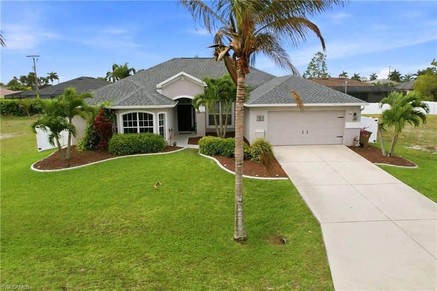 Experience Your Dream Home in This Highly Desirable Neighborhood of SW Cape Coral.  You will Find 3 Bedrooms, Plus a Den (Den includes a closet for storage), 2 Bath Home with Over 2300 Sq Ft of Comfortable Living Area.  The Kitchen has Lovely White Soft-Close Shaker Style Cabinets with Complimenting Quartz Counterstops, a Gorgeous White Backsplash, SS Appliances and a Breakfast Bar.  There is a Formal Living with Electric Fireplace and Dining Area AND a HUGE Family Room Perfect for Entertaining or Just Relaxing!  The Sliders Lead You to the Best Part of the Home, the Heated Pool, Covered Lanai with Electric Fireplace and a Spectacular Separate Landscaped Pergola Area for Enjoying the Florida Lifestyle and Fully Fenced for Privacy.  The Bedrooms have Newer Carpeting and Updated Luxury Vinyl Plank Flooring Throughout, Giving the Home a Seamless Flow.  Roof was Replaced in 2022 and AC in 2021.  This One Truly Feels Like Home!