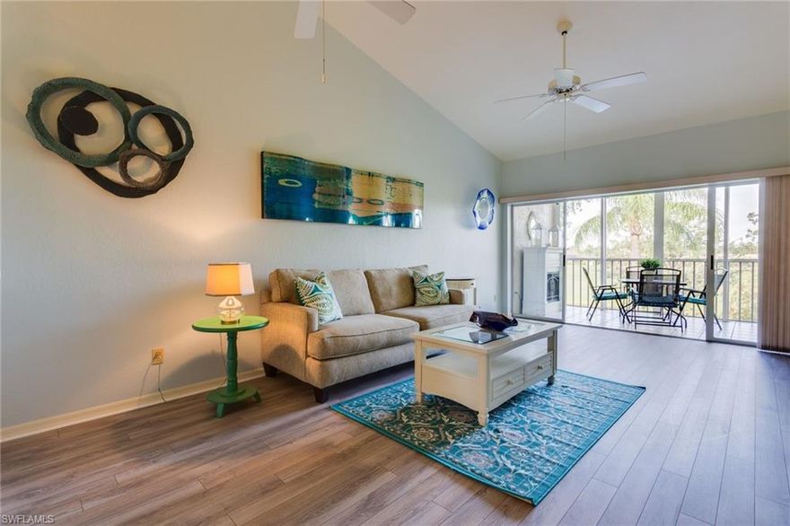 NEW FLOORING JUST INSTALLED MAY 2019! This charming Spanish Wells second floor condo is spacious and bright, features high ceilings, and includes a 1 car detached garage AND 1 golf cart garage. Enjoy spending time outside on your screened in lanai with beautiful golf course and lake view. Plantation shutters and a motorized rolling shutter on the lanai are just some of the features. Located in the Golf Condo sub division just a short distance from the pool that overlooks the golf course. Spanish Wells also offers an optional membership packages in the Spanish Wells Golf and Country Club. This condo is not to be missed!