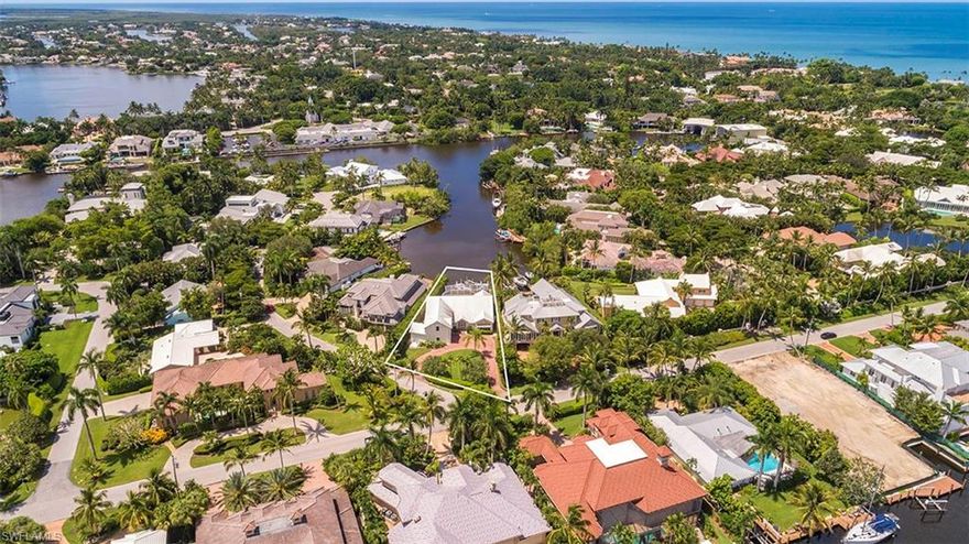 L.2294 - This desirable homesite offers one of the prettiest, long water vistas in Aqualane Shores, looking over Jamaica Cove and on into Jamaica Channel. With an idyllic view and sunny Southwest exposure, this is the perfect setting for a new home. The existing home was built in the 1990s so this property has been priced at vacant land value. Aqualane Shores is a prestigious boating community in Naples, with Port Royal neighboring on the South and Olde Naples to the North. Situated between the Gulf of Mexico and Naples Bay, Aqualane Shores enjoys close proximity to everything Naples is loved for! This charming, waterfront neighborhood provides quick access to Naples Bay for a day of boating in the backwaters or out Gordon Pass to the magnificent Gulf of Mexico. Gulf and Bay breezes, lush tropical landscaping, deep navigable waterways and splendid homes, make this unique neighborhood anything but cookie-cutter! Location is key and this property is conveniently close to a plethora of fine restaurants, boutiques and galleries along Third Street South, the pristine Naples beaches and our famed Fifth Avenue South. Envision your dream home in this slice of paradise!