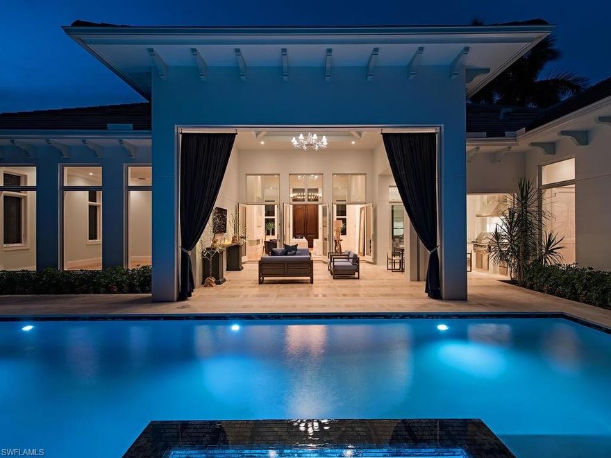 H.11288 - A recently finished single story home in the prestigious Moorings neighborhood is walking distance to both Moorings Private Beach Park & Country Club. Exquisite design coupled with impeccable interior/exterior finishes provides for a luxurious but relaxed lifestyle. Spread over 3868 SF under air living & incorporating 5 ensuite bedrooms plus a powder room.  This Falcon Design home has 10" wide European white oak flooring throughout, a gracious foyer & a great room that flows into the chef's kitchen, dinning, & outdoor living area effortlessly. A built in wet bar off the dinning area provides for both indoor/outdoor entertainment in the covered deck/pool area. Limestone outdoor flooring over poured concrete, coupled with automated screen/shutter system is ideal for carefree living thru out the year. A spacious master bedroom offers a walk in closet and spa bathroom with a generous shower and a cast iron soaking tub. European marble is used thru out the home including all guest bathrooms along with Kohler fixtures. Anderson impact windows and french doors as well as Control 4 home automation system, salt water lap pool and spa, and a mature landscape complete this oasis.