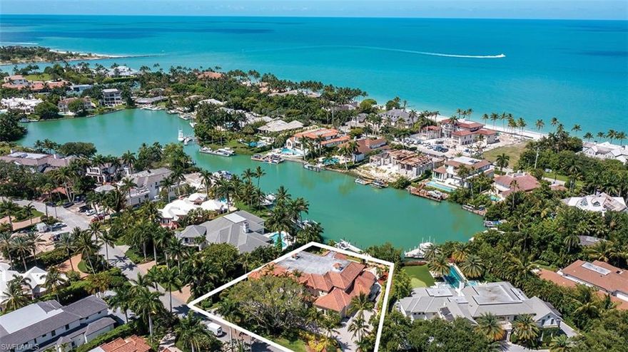 Comfortably tucked in the northern end of Smuggler's Cove sits magnificent 6 bedroom plus den home.   This home boasts 7964 square feet of living area with 3026 square feet of additional outdoor living space. With direct access to the Gulf of Mexico and just 3 homes to the private Cutlass Cove Beach Club, this home has every aspect a beach and boater could want! This property is the ideal boater's paradise, while also being close to Third Street and 5th Avenue South! Enjoy the western exposure and evening sun, as well as the tranquility of Smugglers Cove!  Property also qualifies for Port Royal Club Membership.