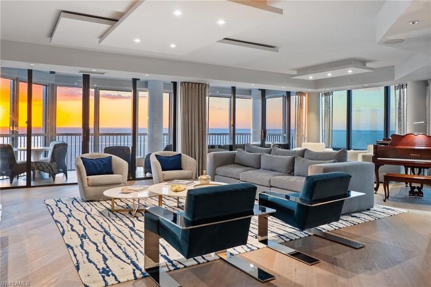 Unobstructed, sweeping views of the Gulf serve as the focal point of this stunning Le Parc corner residence, completely remastered to reflect a refined modern aesthetic. Designed with an eye for architectural detail, the interior showcases clean lines, warm wide-plank flooring, dramatic wood-clad portals, and geometric ceiling details that add depth and architectural interest throughout. The spacious floor plan offers three bedrooms plus a den and is wrapped in floor-to-ceiling glass that fills the home with natural light while perfectly framing the endless coastal vistas beyond. A generous Gulf-facing lanai provides an ideal setting to relax and enjoy the sights and sounds of the shoreline, creating a seamless connection to the beach and the breathtaking beauty of the Gulf.  The sleek kitchen is both functional and fabulous, offering modern custom cabinetry, a large center island with seating, wine storage and clean quartz countertops. Residents will appreciate the primary retreat inclusive of a well laid out bath, spacious closet and seamlessly opening to the den and lanai beyond while family and guests will enjoy the spacious en-suite bedrooms. Le Parc residents and guests enjoy a beachfront oasis complete with a resort style pool, covered spa area, upgraded fitness room, 2 parking spaces and more.