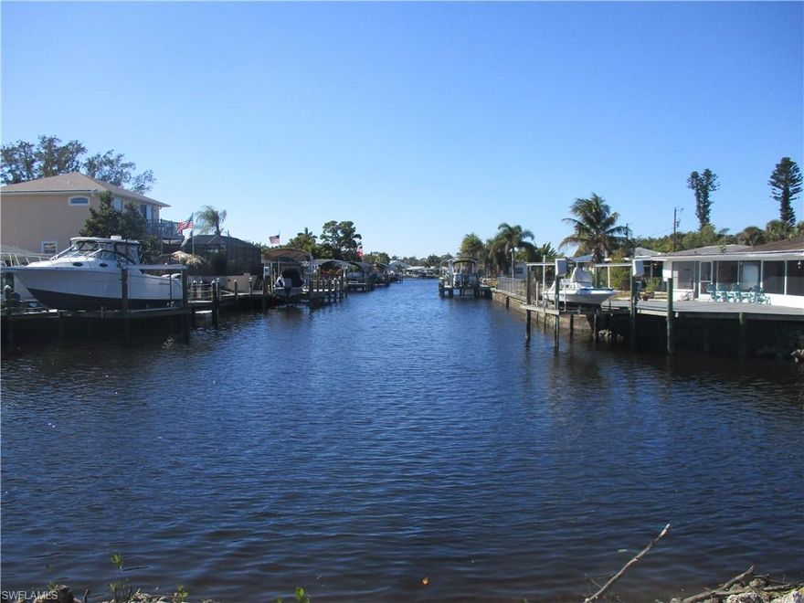 Rare Waterfront Value Opportunity | Prime Canal Location | Assumable VA Loan at 4.25%

A truly rare opportunity to own a prime waterfront lot on a wide canal, complete with direct boating access just minutes from Marina Town and the Caloosahatchee River—perfect for boating, fishing, and waterfront cruising.
The existing structure sustained significant damage during Hurricane Ian and is uninhabitable, presenting an exceptional opportunity for a savvy buyer, investor, or builder to reimagine the property from the ground up. The lot and location are the true gems, offering the ideal setting to rebuild or elevate a new coastal-style residence with a two-car garage below and expansive living space above, designed to capture beautiful water views and refreshing Gulf breezes. Just a few minutes boat ride to the River with Gulf Access. A short walk or boat ride to Marina Town with 3-4 waterfront restaurants and professional offices.
Adding to the appeal, the property offers a rare assumable VA loan at an attractive 4.25% interest rate, subject to lender approval. Purchaser must qualify for VA loan assumption and meet all lender requirements.
Conveniently located near schools, churches, shopping, and a variety of dining options—including waterfront restaurants accessible by boat—this location blends everyday convenience with an exceptional waterfront lifestyle.
Offered “As Is”, this is a standout opportunity to secure waterfront property in a high-demand area with favorable financing in place. Bring your vision, your builder, and your boating lifestyle—opportunities like this are increasingly rare.

“Assumable VA loan at 4.25% available to qualified VA buyer; lender approval required.”
“Existing structure uninhabitable due to storm damage.”
“Value is in land and location.”