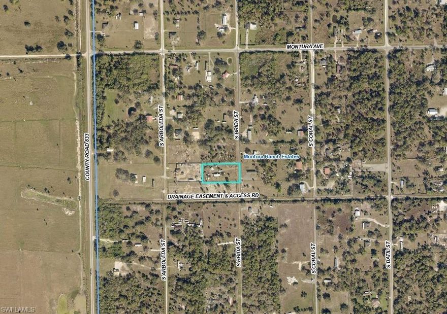 Up for sale is this cozy 2-bedroom/ 1 bathroom with shower 2021 640 sq ft Container Home located in a fenced in 1.25 acre parcel in Montura Ranch Estates. Property has an Electric gate and outdoor kitchen on the open porch for your convenience. Property has custom made Hobby Sheds and fruit trees. Hurricane Impact Windows and tankless water heater included. S Brida St is milled over and located close to Cty Rd 833. This is a NO HOA Rural community and not in a Flood Zone. Community is horse and golf-cart friendly. Great Sturdy home for your country living. Animals welcomed. Plenty of space for your toys. Call to schedule your showing today!