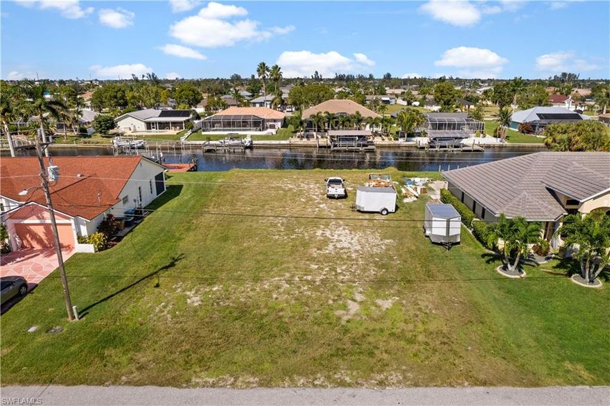 STOP right here! Rare opportunity to own this extra large gulf-access lot on Mast Canal in SE Cape Coral. A perfect place to enjoy stunning sunsets. This great property features seawall completed in 2023, 100 ft water frontage, 145 ft deep and ONLY 1 bridge to cross. BOAT LOVERS - no boat lock!!! PLUS, Assessments are in and paid. Property did NOT flood during Hurricane Ian, nor did the neighboring houses. Locations like THIS are harder and harder to come by. Build the home of your dreams and start enjoying the lifestyle you've always wanted and so deserve!