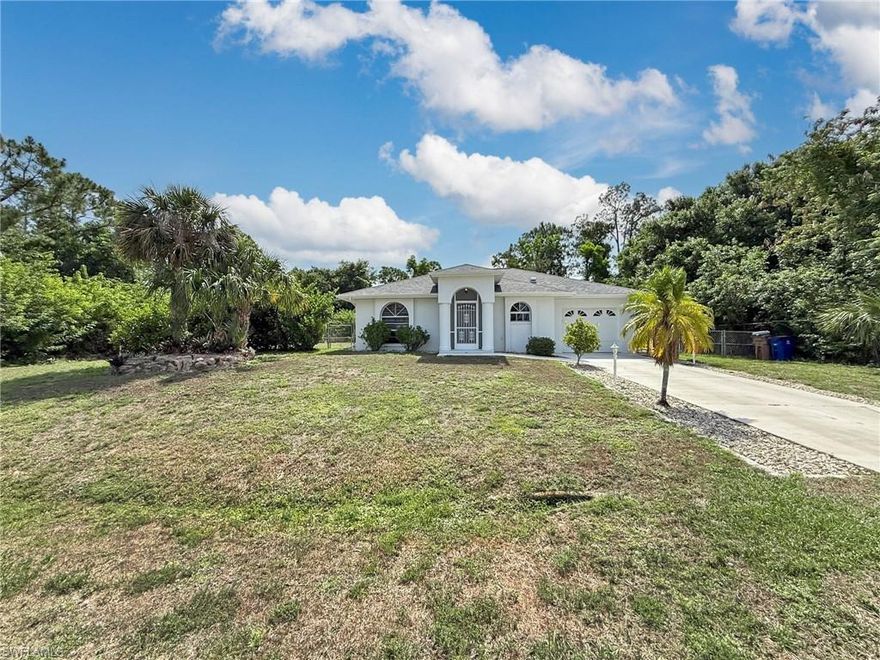 Fully renovated and move-in ready pool home on an exceptionally private, fully fenced double lot, tucked away at the end of a quiet dead end street with no rear neighbors. Surrounded by lush, wooded land for true seclusion. Features include a new roof, updated kitchen and baths, wood-look flooring, repiped plumbing, and a refinished pool. Bright, open layout with sliders to a spacious screened lanai perfect for indoor/outdoor living. Ample space for pets, play, or storing a boat. A rare opportunity to own a peaceful Florida retreat just minutes from, Southwest FL Airport, local shopping, dining, parks, and more.