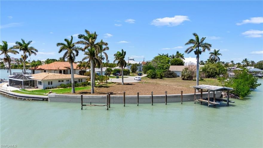 STUNNING WATERFRONT VIEWS. Enjoy 135 feet of sparkling Gulf water with a brand new seawall, direct water access, tip lot with southern exposure and deep water for any boating vessel!

This is a rare opportunity to own one of the premiere waterfront lots in southwest Florida. Offering breathtaking panoramic views of the pristine waters of Tarpon Bay and quick access to the open waters of the Gulf. Watch the dolphins and manatees play in your backyard and enjoy world class fishing in the Gulf or explore the Ten Thousand Islands. Located just minutes from local beaches, golf courses, and high-end dining and shopping, this waterfront gem combines the serenity of coastal living with convenient access to all the best Florida has to offer. Owner has all permits necessary for large dock and boat house along with plans for a custom home if interested. Your dream home awaits!