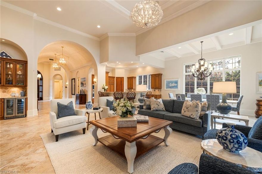 Imagine ending each day with the glow of the setting sun casting golden light across your private lanai, the sounds of the spa gently bubbling in the background, and long lake views framed by swaying palms and protected nature preserve. This is not a vacation—your everyday life unfolds in the home you have been waiting to discover.  Located in Positano, an intimate enclave of just 16 residences, thoughtfully set amid golf course preserves and serene lakes.  From the moment you arrive, the setting feels different. Experience exceptional privacy with open exposures to the south, east and west, and tranquil water views framing both the front and rear of the home. Mature landscaping that whispers privacy and calm. Inside, every detail has been designed to support how you want to live—light-filled, open, and inviting. Volume ceilings, expansive windows, arched hallways, and rich millwork create a bright, airy atmosphere, while an open floor plan encourages connection.  An elegant curved ceiling with detailed indirect lighting adds architectural interest, and the great room—anchored by a striking double tray ceiling—is where friends gather and lasting memories are made.The chef’s kitchen is a joy to cook in, with natural gas cooking, a walk-in pantry, and a breakfast bar perfect for casual meals, or wine and conversation in the evening.  Enjoy the expansive dining area highlighted by a beamed ceiling and uninterrupted views.  You’ll find the private study becomes more than a workspace—it’s a retreat with beamed ceiling, large windows and a custom built-in.  When it’s time to unwind, your primary suite offers total escape: hardwood floors, a generous closet and a sitting area where morning coffee becomes a daily ritual. The home’s thoughtful layout ensures everyone has their own space, including two beautifully appointed guest suites, each with its own en-suite bath. A powder bath and a pool bath add convenience for both guests and daily living.  Outdoors, you’ll live in rhythm with the sun. Relax in the pool, unwind in the spa, enjoy al fresco dinners under the stars or watch the sky fade into dusk from your chaise lounge.  Enjoy the peace of mind of impact rated windows along with a 30K natural gas generator and tankless water heater. The two-car garage provides space for vehicles as well as additional storage.  And then, there’s Mediterra.  Enjoy 36 holes of Tom Fazio-designed golf in the morning, or challenge friends to a round of pickleball or a match on the Har-Tru tennis courts. Explore miles of walking and biking trails, or join a bocce match with neighbors. Coming soon is the new Sports & Lifestyle Center.  Head to the renovated Mediterra Beach Club where valet service greets you and your chairs and umbrellas are set. Swim, relax, & stay for dinner as the sun dips below the horizon.  This is not just a property. It is a promise—of balance, of beauty, of refined living, and of a life well lived.